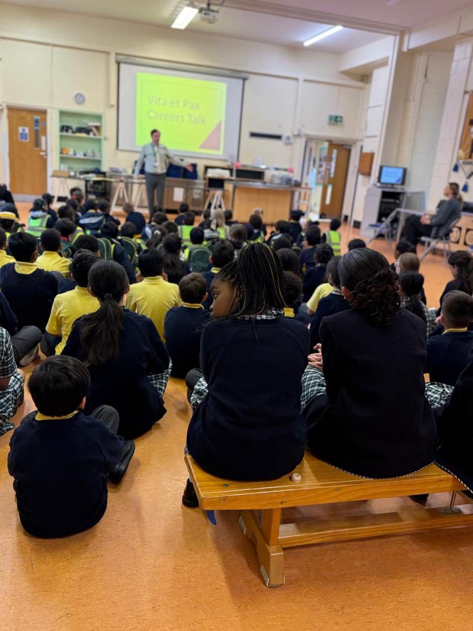 Pupils listen attentively during a careers talk in assembly.