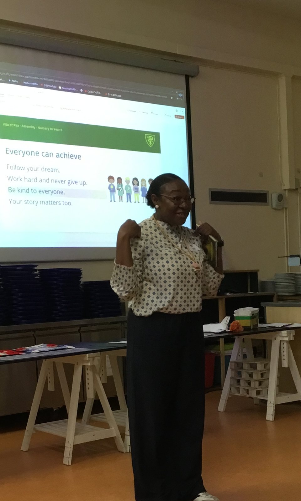 Mrs Sophia Ovonlen speaking in front of a slide that reads "Everyone can achieve"