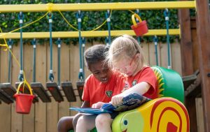 children reading outside