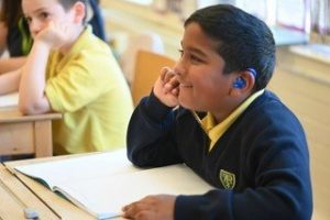 student listening in the classroom