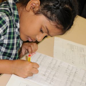 girl practising her hand writing
