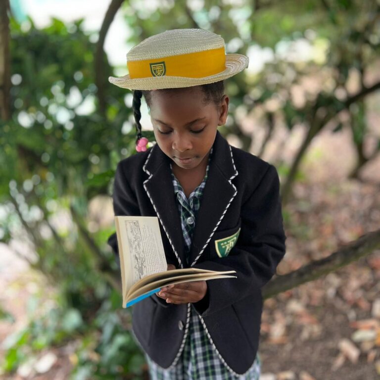 student reading outdoors
